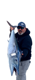 Casey with a nice wahoo caught on the bomb onboard the Independence