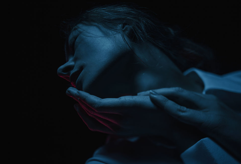 girls chin and face in weak blue light, low key studio photography Omid Taslimi Photography