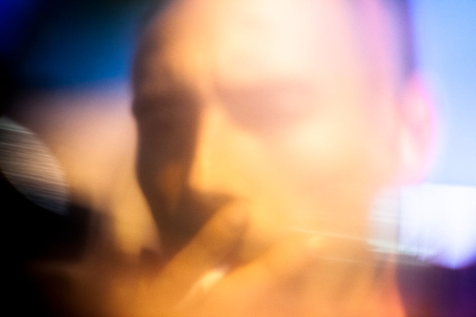 blurry image of a young man smoking a cigarette in the night, Photography by Omid Taslimi