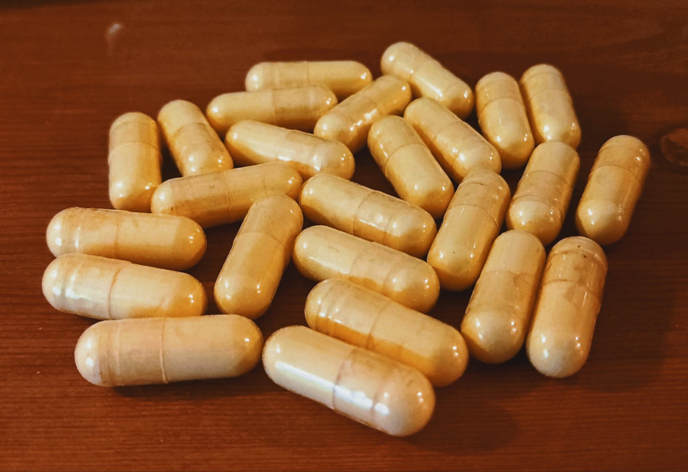 Noble Fiji Kava Extract Capsules sitting neatly on a textured surface.