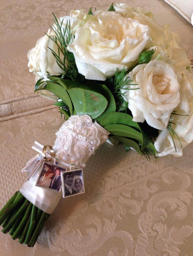 bridal bouquet with charms attached to honor lost loved ones