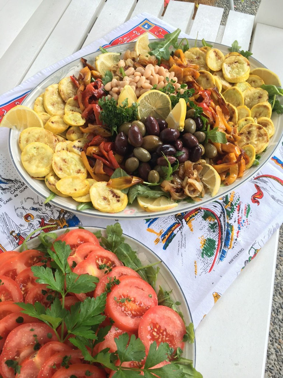 Mediterranean vegetables served with a simple tomato salad.