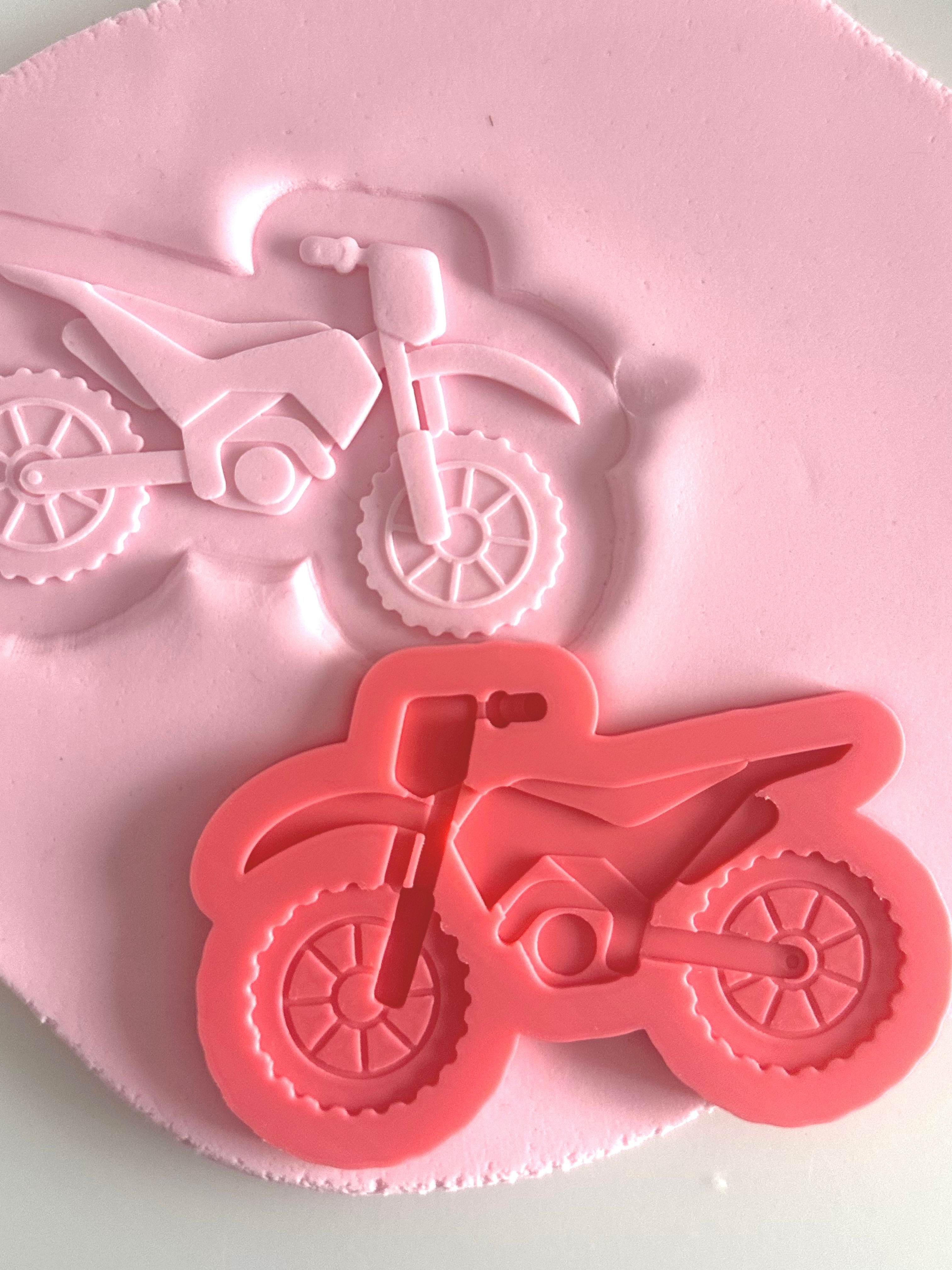 Motorbike debosser with matching cutter