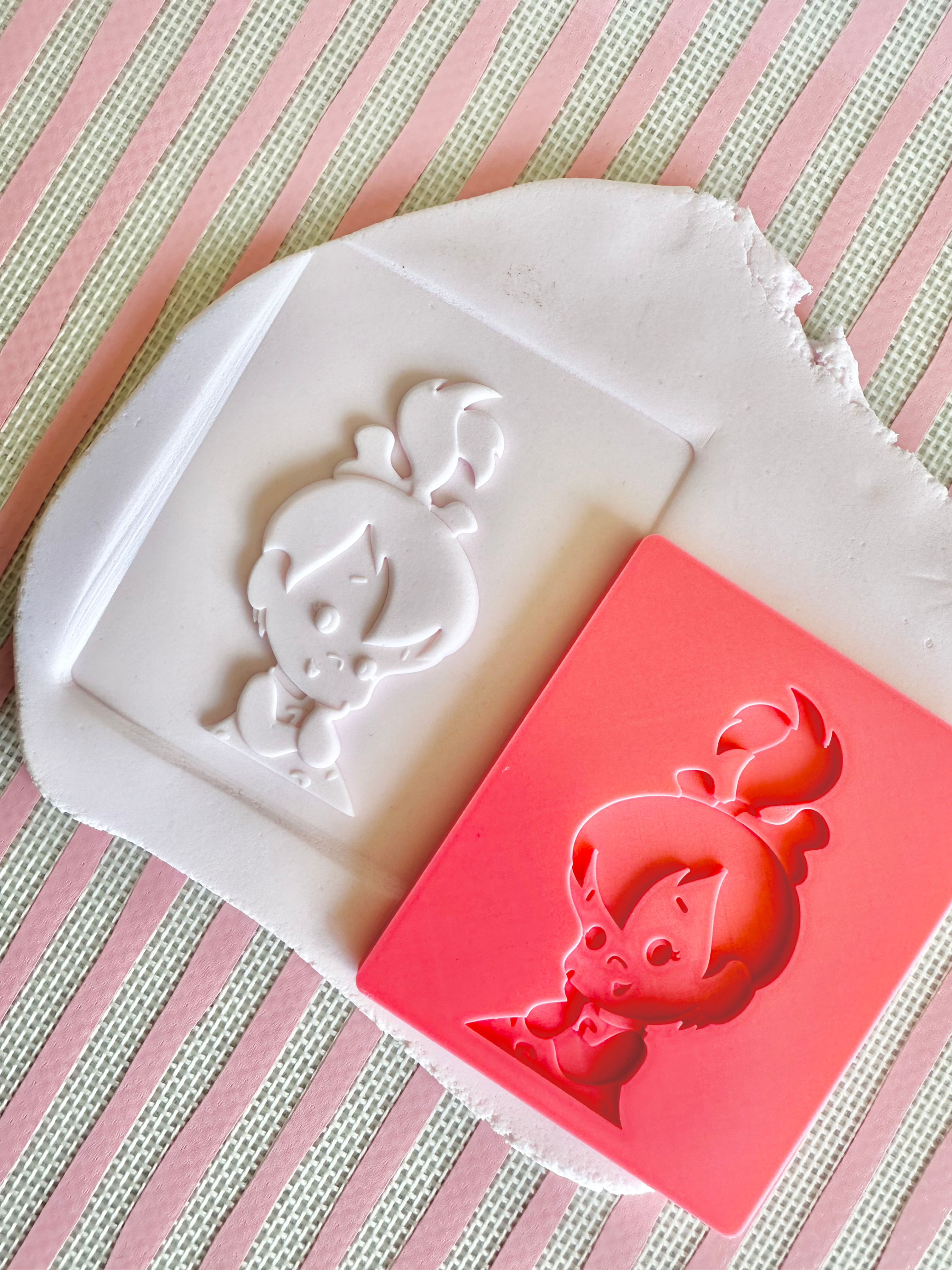 Pebbles (The Flintstones) debosser with matching arch cutter