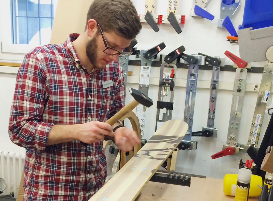 Super Skis on the assembling phase. A technician assembles Super Skis on his benchtop