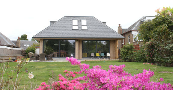 larch cladding with a slate roof and Velux windows