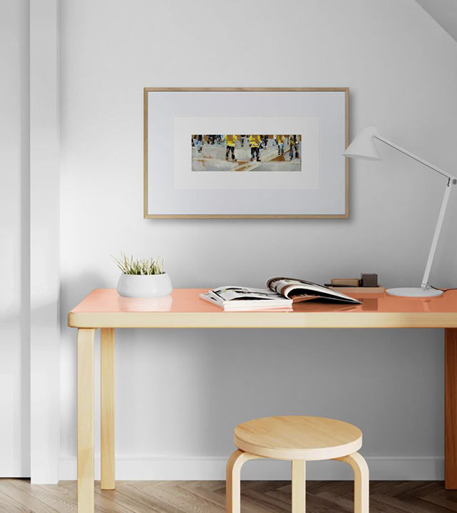 Framed fine art print of 'Under Watch' displayed in a home, celebrating the intensity and excitement of football match day
