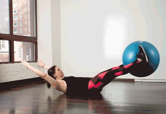 STABILITY-BALL-ABS_HANDS-TO-FEET-PASS.gif.webp