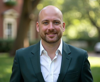 Martin Hill Headshot - Casual green suit. Half body.png