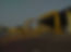 Large yellow EOT crane outside factory
