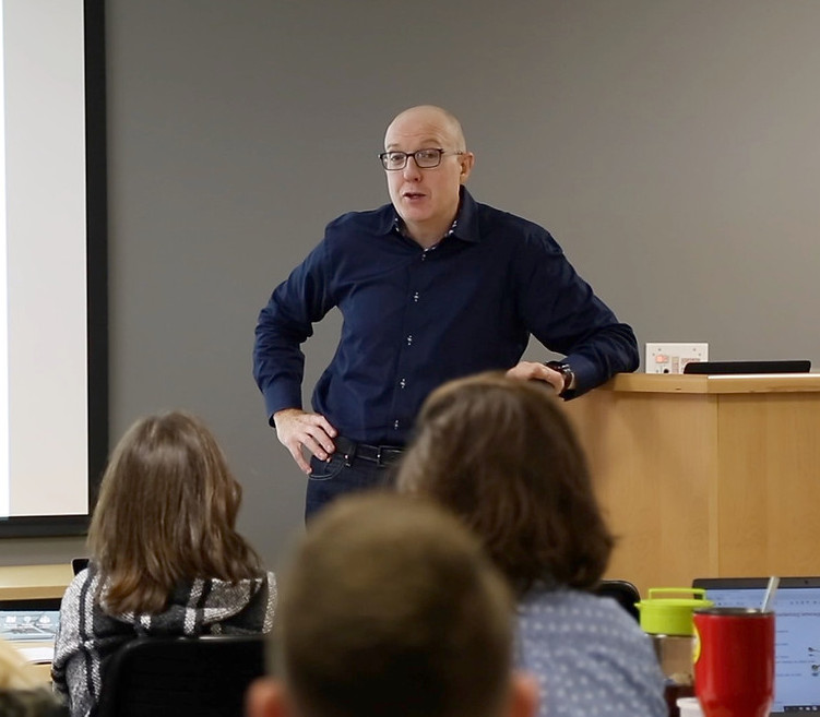 Chris Aarons speaking at a keynote engagement