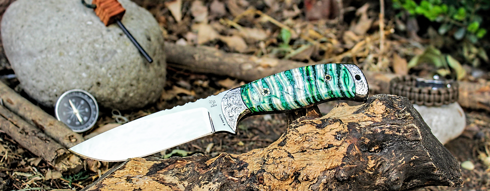 Close-up view of a camping knife on a wooden table