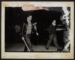 20 Plain clothes police leaving Brixton Police Station with pick axe handles. 12th April 1981. Huntl