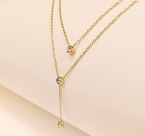 Elegant gold-tone layered necklace with round stone accents on fine chain – Tanara jewelry