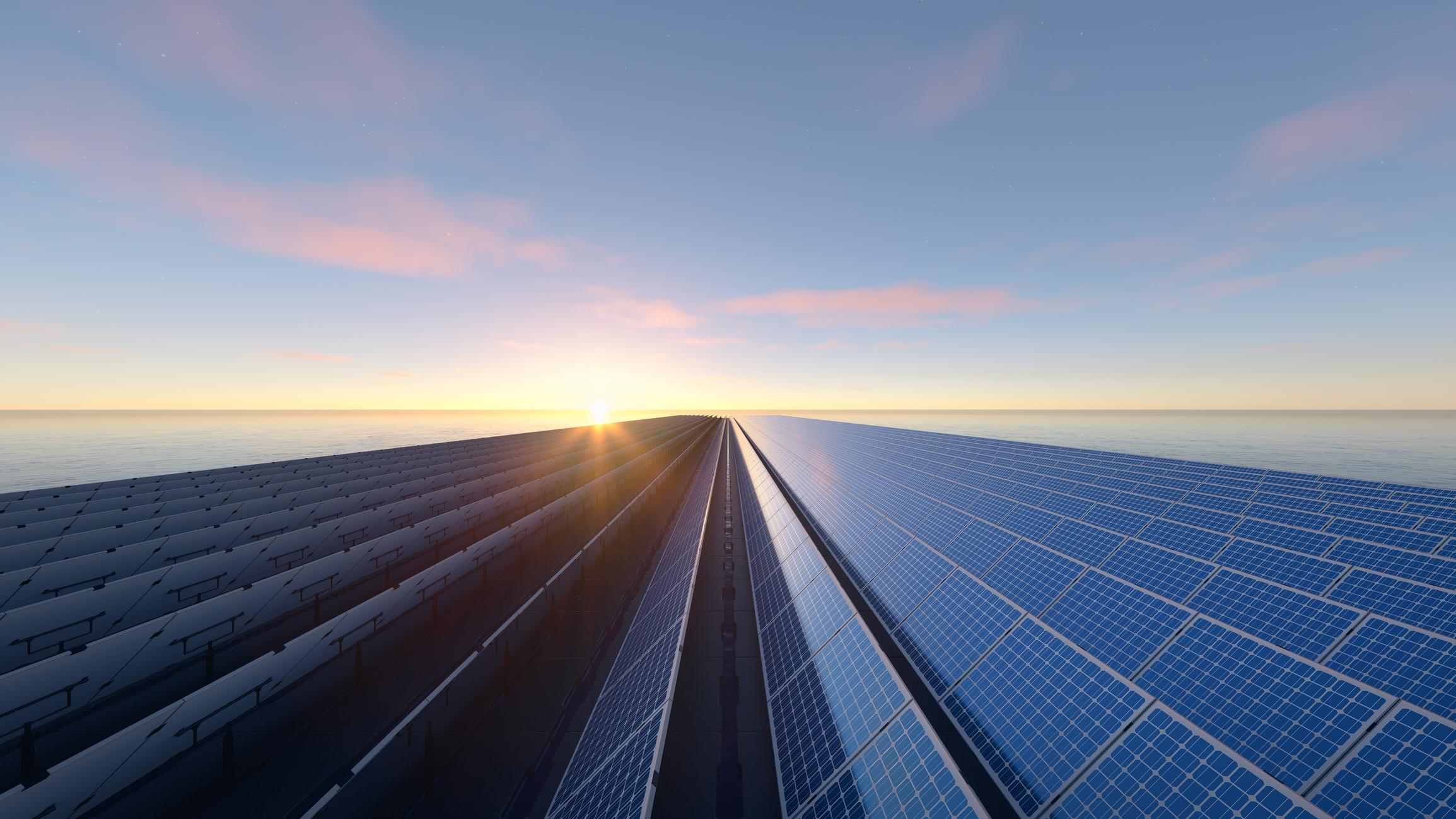 Solar panels beneath a peaceful sunrise
