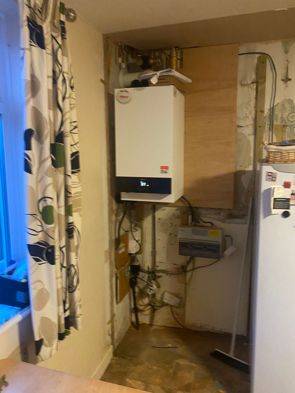 a white boiler with a sticker that says ' boiler ' on it