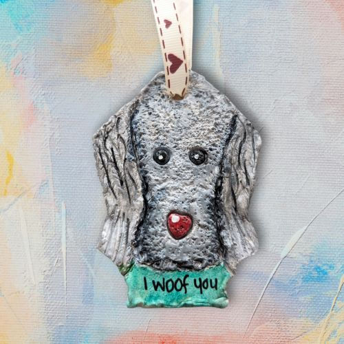 grey dog clay decoration with red heart nose