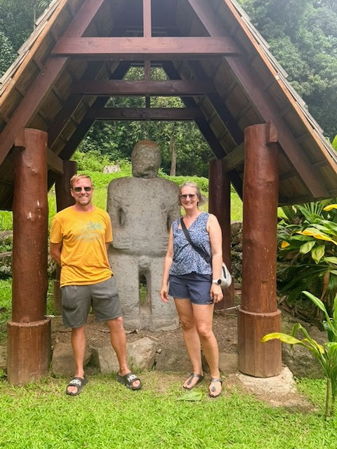 Posing with a big Tiki