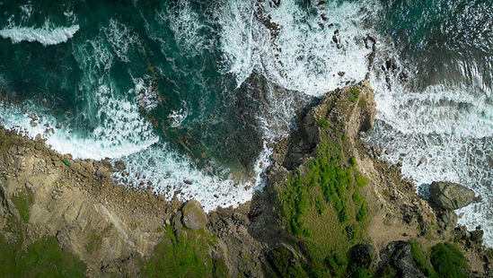 Birds eye aerial of crashing waves