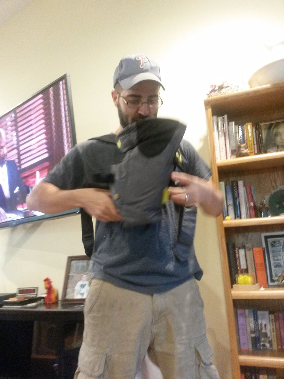 Daddy trying on the baby carrier