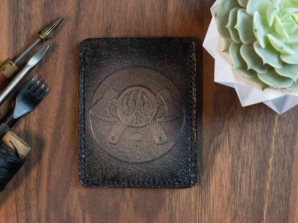 leather card holder with embossed Viking-style design”