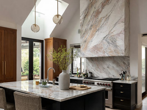 Completed luxury kitchen remodel in Boulder, Colorado featuring custom cabinetry, statement stone detailing, and a cohesive material palette, all defined during the design phase prior to construction.