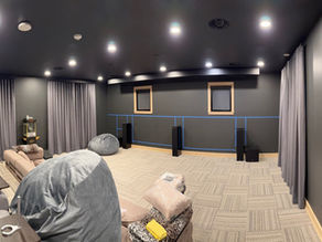 Black velvet drapery in a black walled theater room in a Lake CDA home