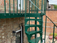 Green metal fire escape stairs
