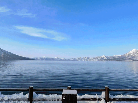 snow on the side of a lake
