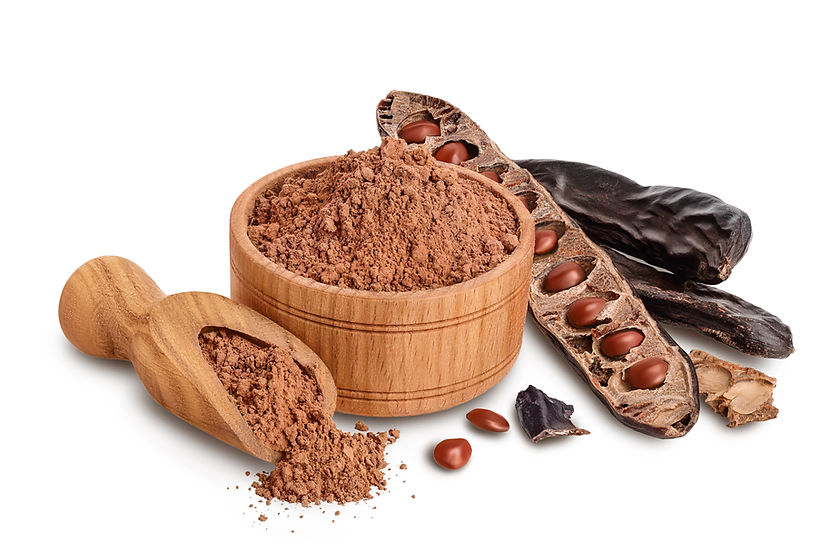 Carob pod and powder in wooden bowl isolated on white background with clipping path and fu