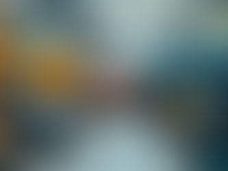 Two men shaking hands in a factory setting.