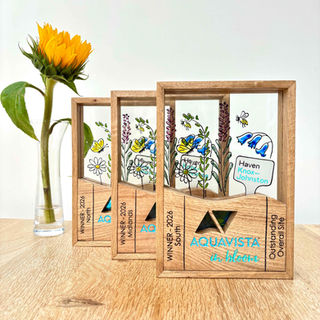 3 hand painted Trophies to celebrate the botanical achievements of the winning participant marinas of 'Aquavista in Bloom'. A yearly competition to encourage member marinas to create vibrant floral displays and encourage local wildlife.
These trophies have been sponsored by Haven Knox-Johnston and depict the marketing imagery painted on glass, logos, laser engraving all set in oak plinths and frames.
Hand made by Seaview Studio, Hampshire