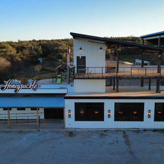 Honeysuckle restaurant interior showing bar and dining layout in Texas
