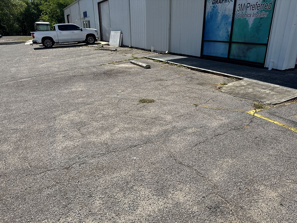 Florida rain and humidity causing faded parking lot striping in Pensacola