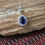 Thumbnail: Gorgeous Australian Blue Sapphire Pendant with White Topaz Accent Stones