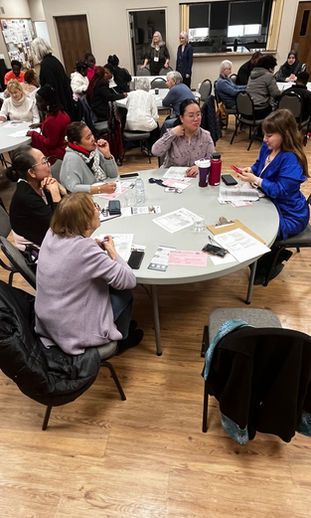 Viktoria Bulat facilitates a table discussion.