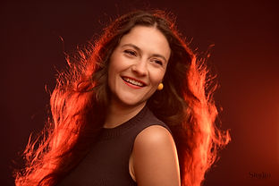 A lyric artist originally from Lyon, she began her training at the Conservatoire and the Maîtrise of the Opéra de Lyon, where she studied dance and piano and took her first steps on stage. She later continued her studies at the CNSMD de Lyon in the classes of Sophie Marin-Degor, Hélène Lucas and Nobuyoshi Shima.
She then joined Wilfrid Laurier University (Waterloo, ON, Canada), studying with Leslie Fagan, where she joyfully discovered the English-language operatic repertoire. After obtaining the Diplôme d’Études Vocales from Notre-Dame de Paris, she pursued further vocal training with Valérie Guillorit at the Royal Flemish Conservatory, as well as at the Opéra Studio of La Monnaie / De Munt.
She performs regularly in French and Belgian opera houses, notably in Offenbach roles (Alexis, Oreste, Cupid) under the direction of Enrique Segura. She has also appeared alongside Les Paladins – Jérôme Correas as Liesgen in Bach’s Coffee Cantata at the Opéras of Massy and Nantes, and as Meg Page in Falstaff with the MM Academy of La Monnaie / De Munt. Her recent roles include Musetta (La Bohème) at Forges Opéra, Second Woman (Dido and Aeneas) at the Opéra Royal de Versailles conducted by Stéphane Fuget, and Eurydice in Gluck’s Orphée et Eurydice with the orchestra Des Cybèles in Lyon.
As part of the Udo Reinemann International Masterclasses, she gave a recital of mélodies and lieder at La Monnaie / De Munt. She was also soprano soloist in Caldara’s Laudate Pueri with Amici miei, and in César Franck’s The Seven Last Words of Christ on the Cross, conducted by Éloïse Magat.
She distinguished herself at the 2025 Clermont-Ferrand International Opera Competition, winning two prizes (Messiah and Dido and Aeneas), and is also a laureate of the Royaumont Foundation.
During the current season, she appeared as Daphne (Actéon, Charpentier) in a production of the Académie de l’Opéra Royal de Versailles conducted by Chloé de Guillebon. With the Il Caravaggio Studio – Camille Delaforge, she recorded the role of the Statue (Pygmalion, Rameau), performed as a soloist in the recital Mi palpita il cor at the Saint-Denis Festival, and sang the role of the Gypsy Woman (Le Carnaval de Venise, Campra) on a French tour with La co(opéra)tive, appearing notably at the Opéras of Rennes, Nantes and Compiègne, where she also performed the role of Minerva.
In 2026, she will appear as soprano soloist in Der Messiah (Handel and Mozart), a production of the Opéras of Limoges and Clermont-Ferrand, staged by Lodie Kardouss and conducted by Nicolas André. She will also sing the title role in Cendrillon by Pauline Viardot with La co(opéra)tive at the Scène nationale de Dunkerque, perform as soprano soloist in Purcell’s The Fairy Queen, and sing the roles of the First Witch and Second Woman in Dido and Aeneas with Ensemble Les Surprises, touring until 2027, including performances at the Opéras of Bordeaux, Compiègne and Clermont-Ferrand.

Adagio Artists