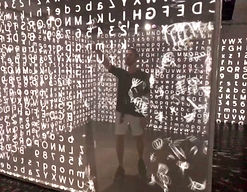 Igor Siberia pointing toward a wall of flying numbers, symbolizing advanced scientific research in consciousness and breath