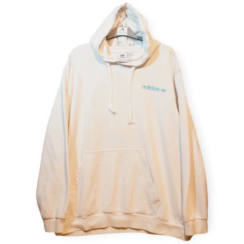White Adidas Originals oversized pullover hoodie, size XL. Features a small blue embroidered logo on the front chest