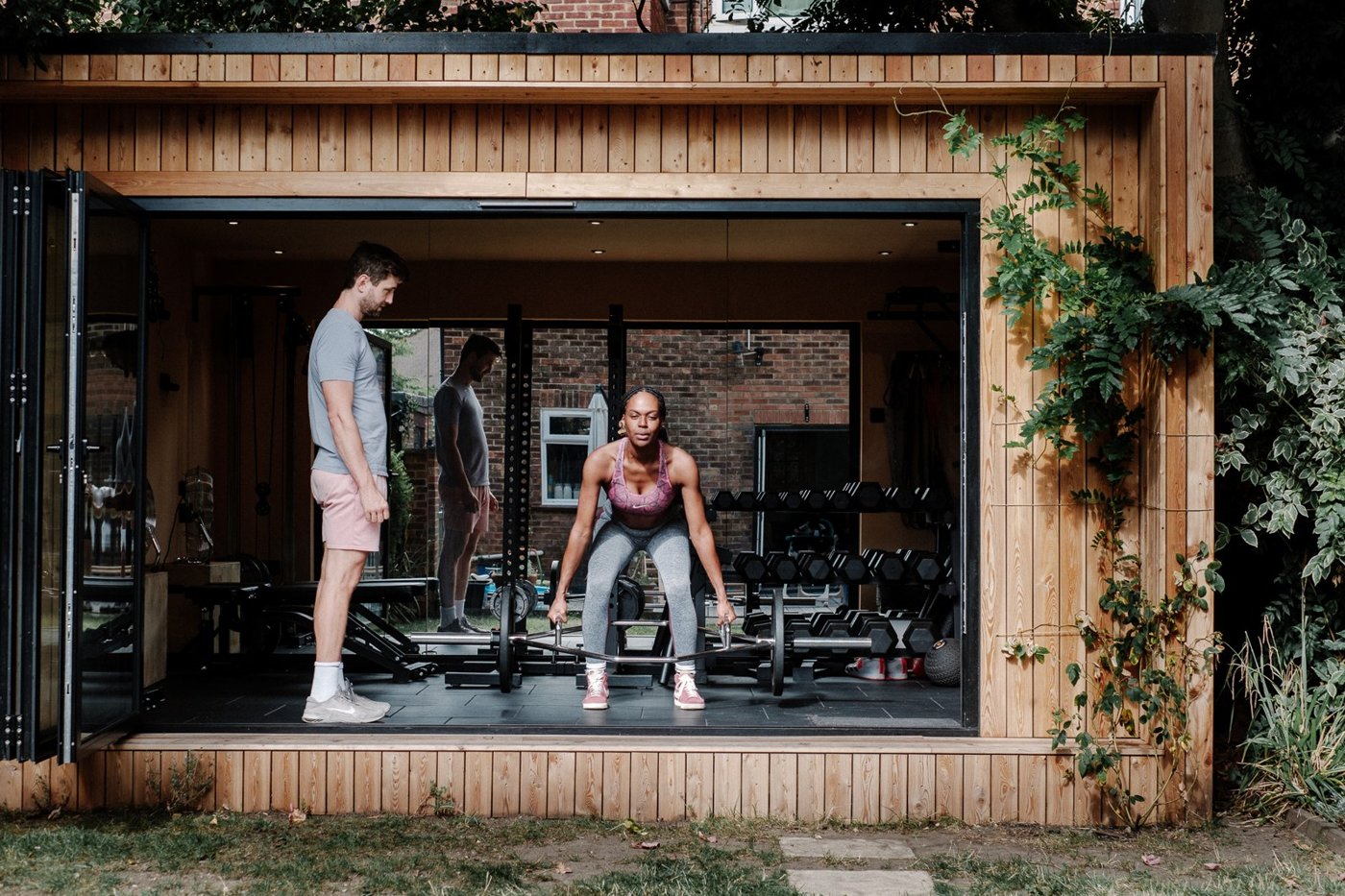 Jack coaching a client in the open garden studio
