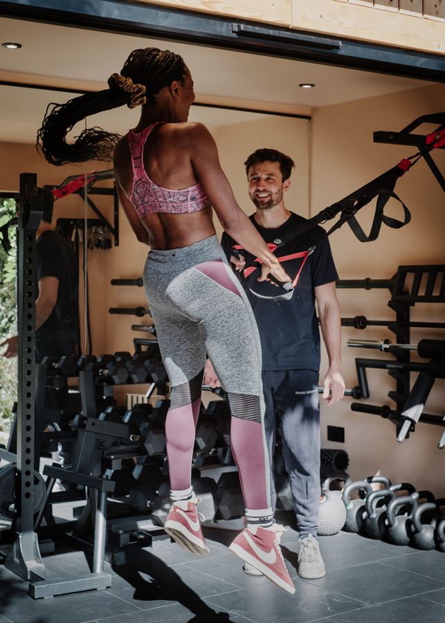 Jack coaching a client through a jump in the studio