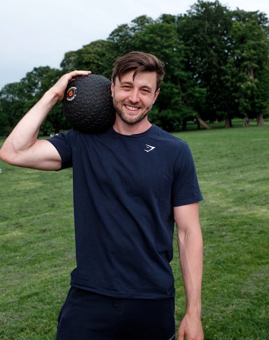 Jack holding a slam ball in Ruskin Park