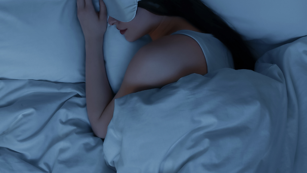 Woman sleeping in bed representing nighttime routine where magnesium lotion is used before bed