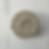 Close-up of Juneberry Apothecary shampoo bar featuring embossed botanical design on the surface.