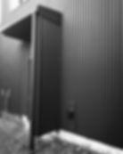 Black corrugated metal siding