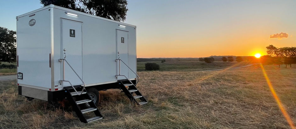 Luxury portable bathroom set against a sunset