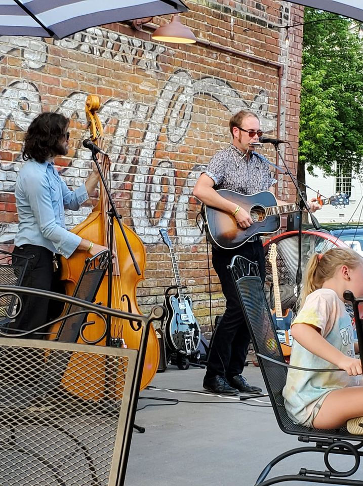 Live musicians performing on Charters Patio
