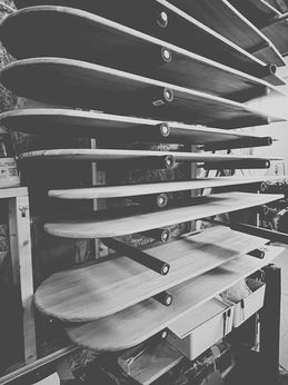 workshop rack filled with surfboards