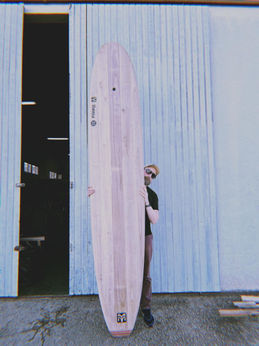 Full-length view of a theory surfboards