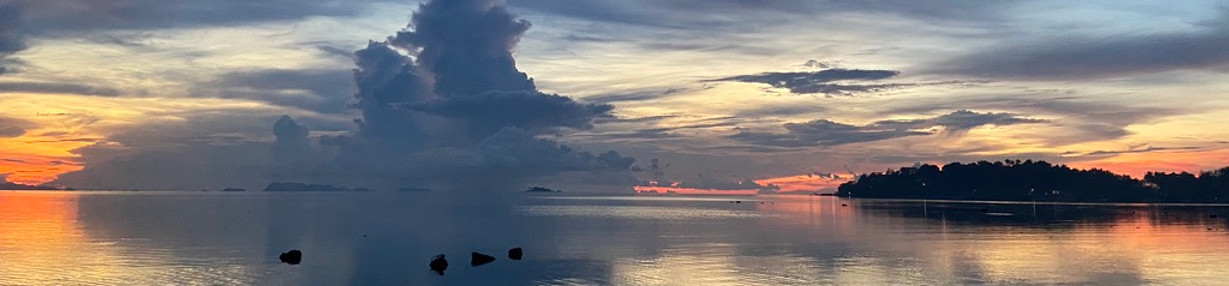 A sunset view over the calm water surface